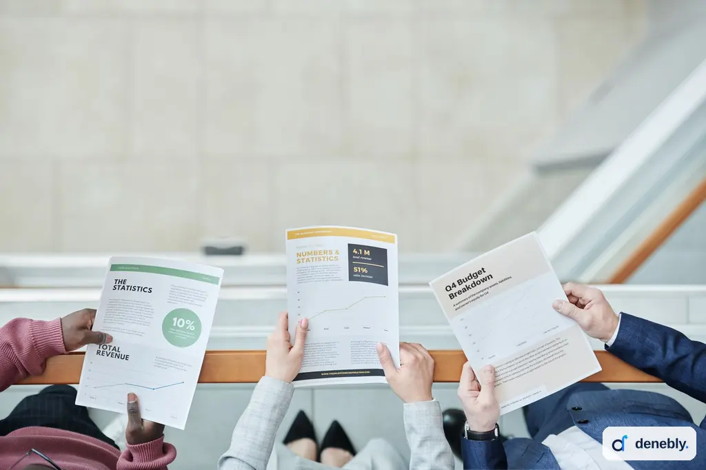 Hands holding financial reports during an AI automation cost review