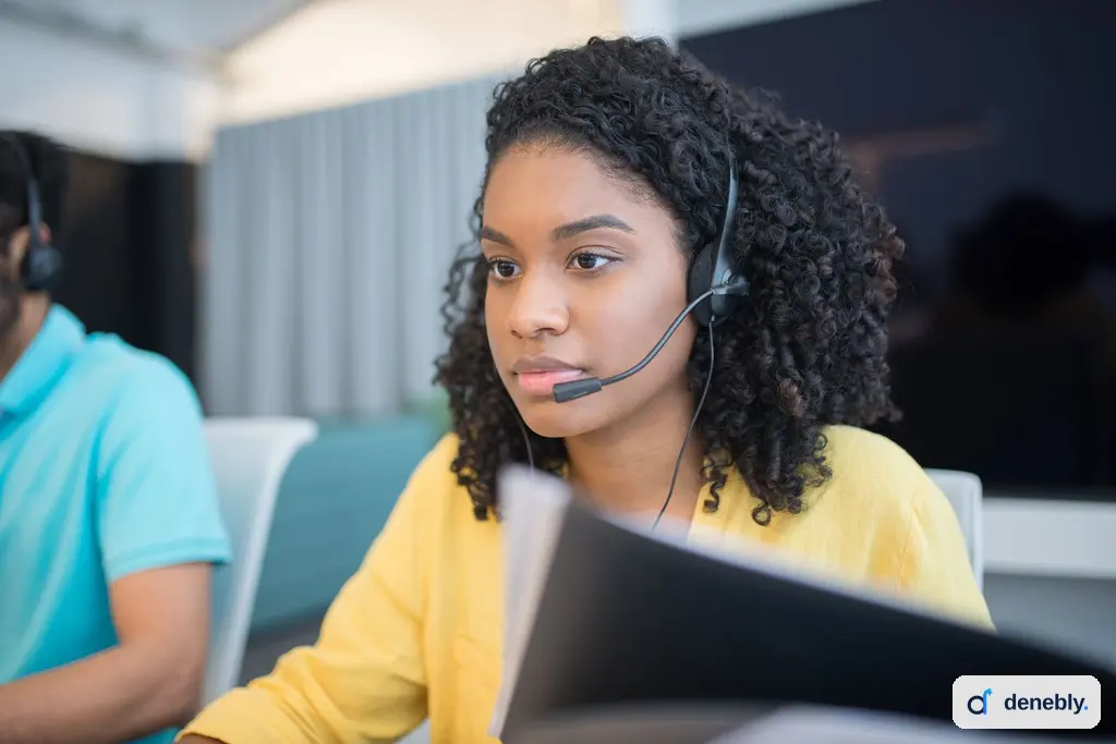 Customer service representative wearing a headset during a support conversation